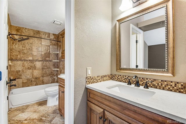 12535 Forest View St, Broomfield, CO 80020 - bathroom featuring vanity, visible vents, a textured wall, toilet, and shower / bathing tub combination