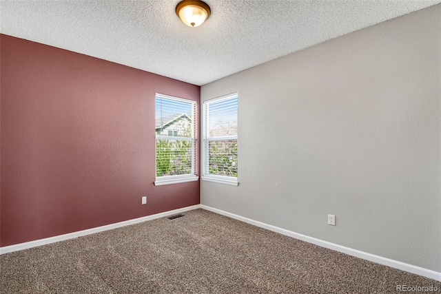 12535 Forest View St, Broomfield, CO 80020 - carpeted spare room featuring baseboards, a textured ceiling, and visible vents