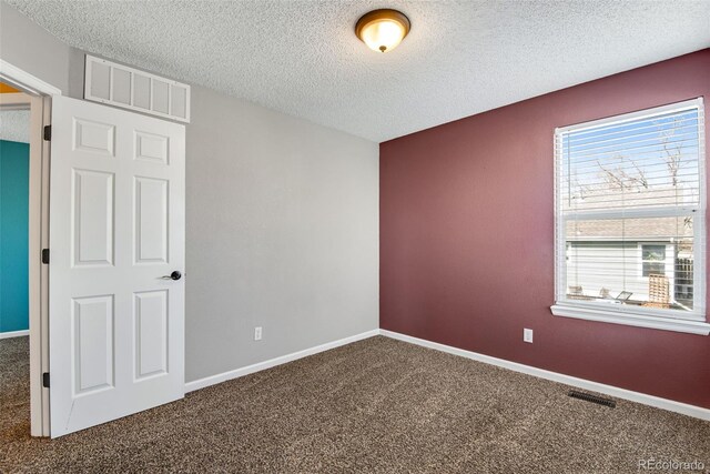 12535 Forest View St, Broomfield, CO 80020 - spare room with visible vents, a textured ceiling, and carpet