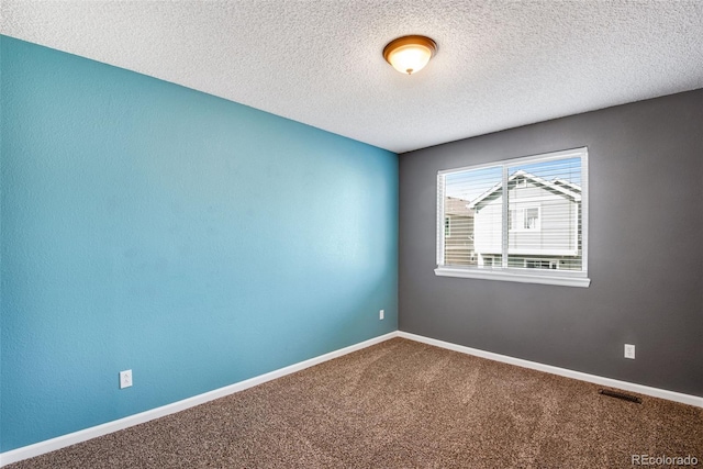 12535 Forest View St, Broomfield, CO 80020 - carpeted empty room featuring baseboards, a textured ceiling, and visible vents