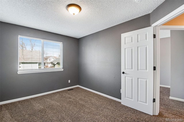 12535 Forest View St, Broomfield, CO 80020 - spare room with carpet floors, a textured ceiling, visible vents, and baseboards