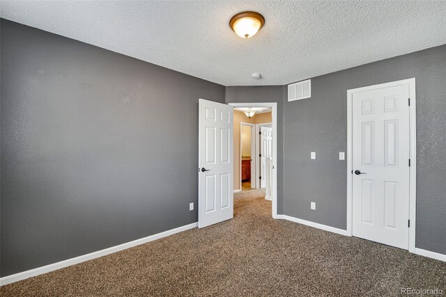 12535 Forest View St, Broomfield, CO 80020 - unfurnished bedroom featuring carpet flooring, a textured ceiling, visible vents, and baseboards