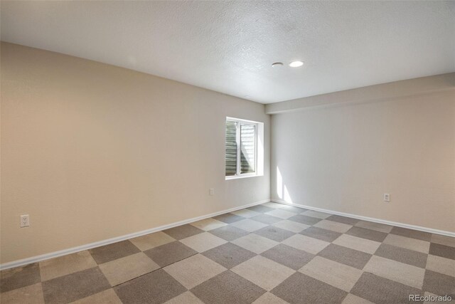 12535 Forest View St, Broomfield, CO 80020 - empty room featuring recessed lighting, baseboards, and a textured ceiling