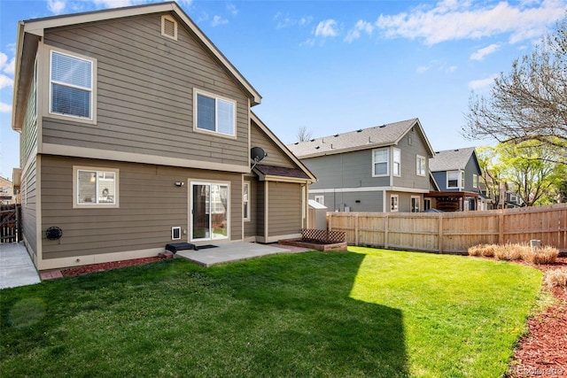 12535 Forest View St, Broomfield, CO 80020 - back of house featuring a fenced backyard, a yard, a patio area, and a residential view