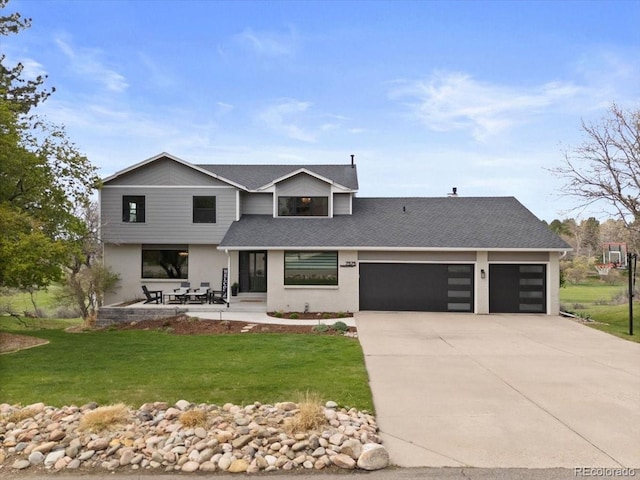 view of front of home featuring a front lawn, concrete driveway, an attached garage, a shingled roof, and stucco siding