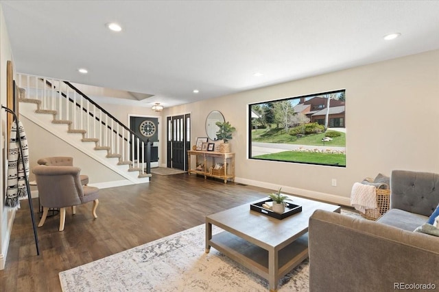 living area featuring recessed lighting, baseboards, stairs, and wood finished floors
