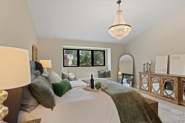 bedroom with carpet flooring, baseboards, an inviting chandelier, and lofted ceiling