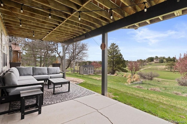view of patio with a storage shed, an outdoor living space, and an outbuilding