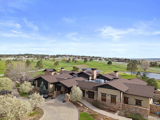 aerial view featuring a water view and view of golf course