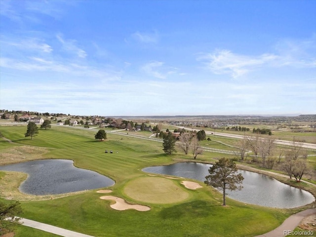 view of property's community featuring a water view and view of golf course