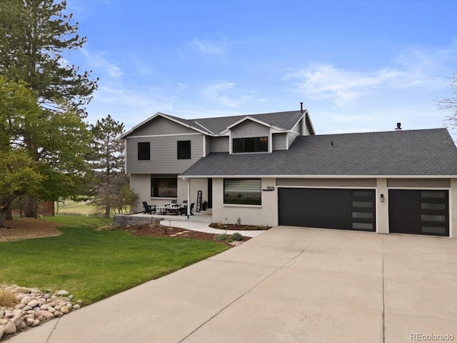 view of front facade with a garage, a shingled roof, concrete driveway, and a front lawn