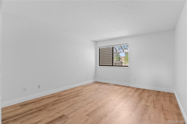 3871 E Euclid Ave, Centennial, CO 80121 - empty room featuring light wood-type flooring and a textured ceiling