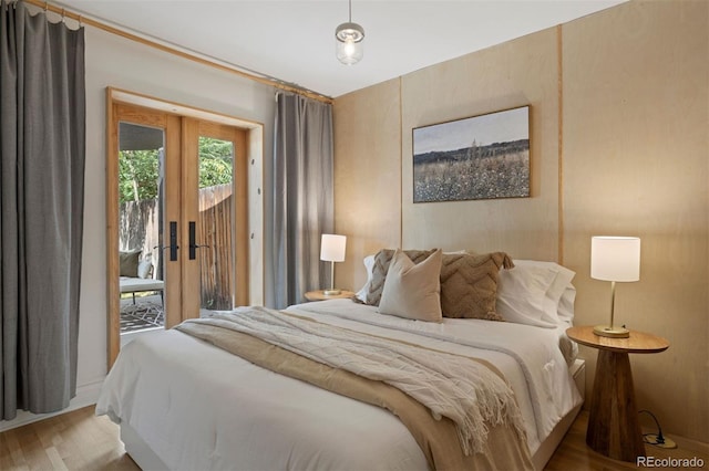 bedroom with access to outside and french doors