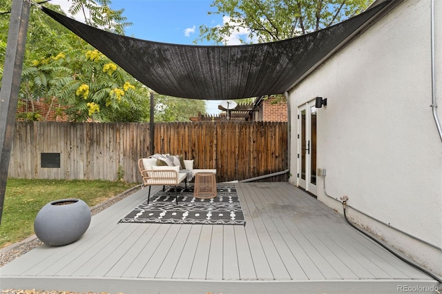 wooden deck featuring fence and outdoor lounge area