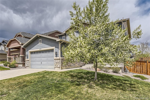 11771 W Quarles Ave, Littleton, CO 80127 - craftsman house featuring board and batten siding, driveway, stone siding, and a garage