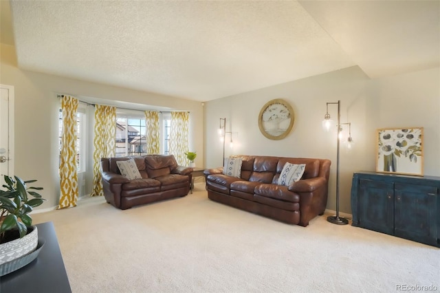 carpeted living room with baseboards and a textured ceiling