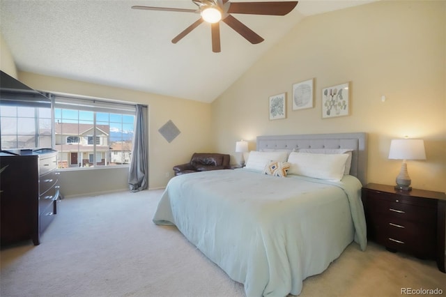 bedroom featuring lofted ceiling, light colored carpet, and ceiling fan