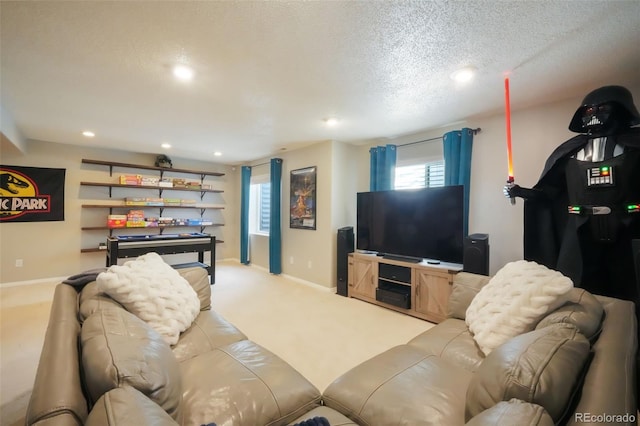 carpeted living area with recessed lighting, baseboards, and a textured ceiling