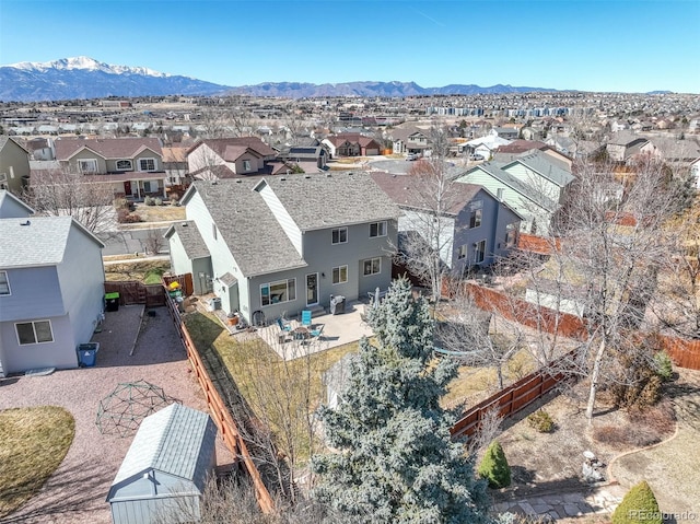 birds eye view of property featuring a mountain view and a residential view