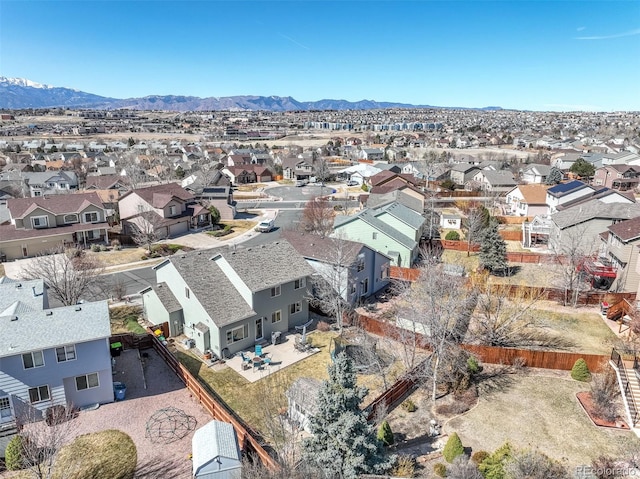 drone / aerial view featuring a mountain view and a residential view