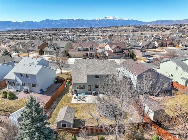 birds eye view of property with a mountain view and a residential view