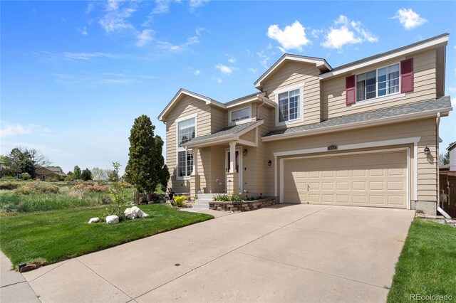 408 Sylvestor Trl, Highlands Ranch, CO 80129 - view of front of property with an attached garage, driveway, a front yard, and roof with shingles