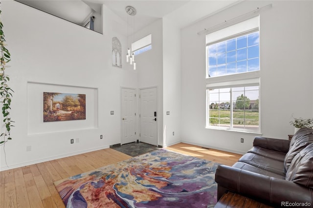 408 Sylvestor Trl, Highlands Ranch, CO 80129 - entryway featuring wood finished floors and a towering ceiling