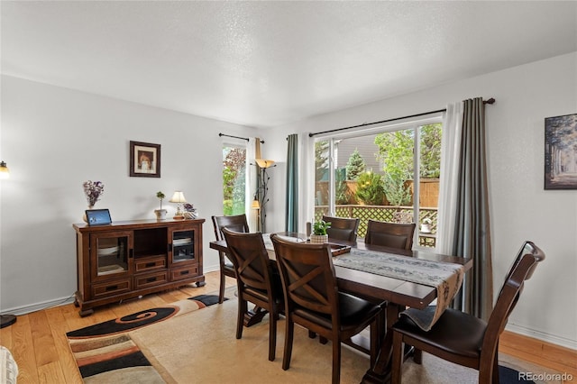 408 Sylvestor Trl, Highlands Ranch, CO 80129 - dining room featuring light wood-style flooring and baseboards