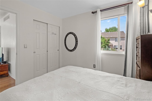 408 Sylvestor Trl, Highlands Ranch, CO 80129 - bedroom featuring wood finished floors and a closet