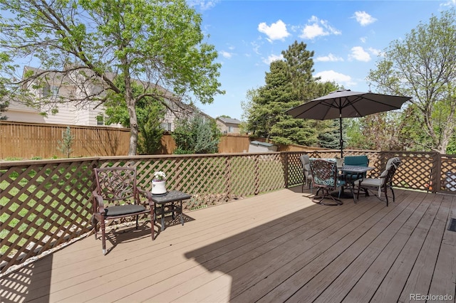 408 Sylvestor Trl, Highlands Ranch, CO 80129 - wooden terrace featuring outdoor dining area