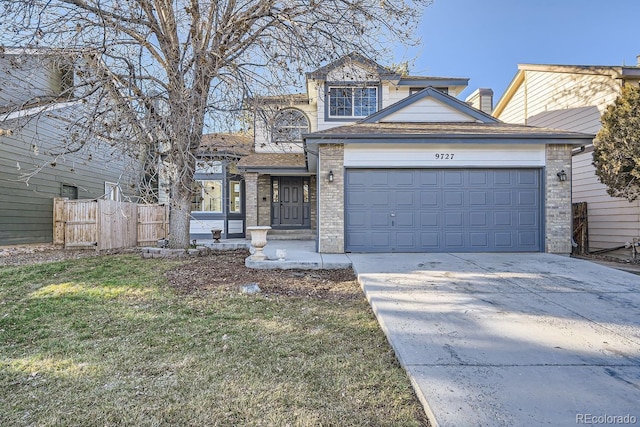 front of property with a garage and a front yard