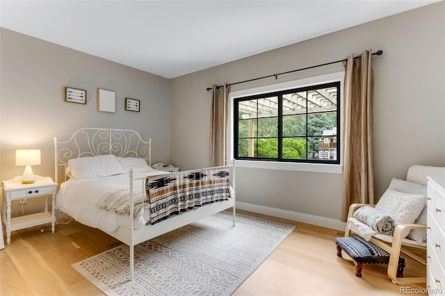 1311 Fletcher Dr, Erie, CO 80516 - bedroom featuring light wood-style floors and baseboards
