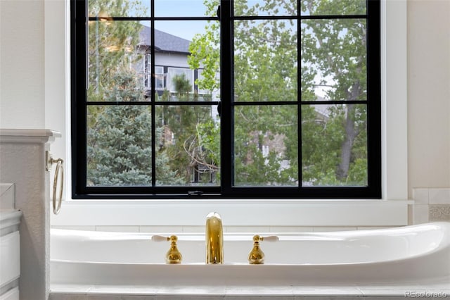 1311 Fletcher Dr, Erie, CO 80516 - full bathroom featuring a bath and plenty of natural light