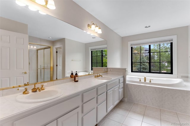 1311 Fletcher Dr, Erie, CO 80516 - full bath with a garden tub, a stall shower, double vanity, and tile patterned floors