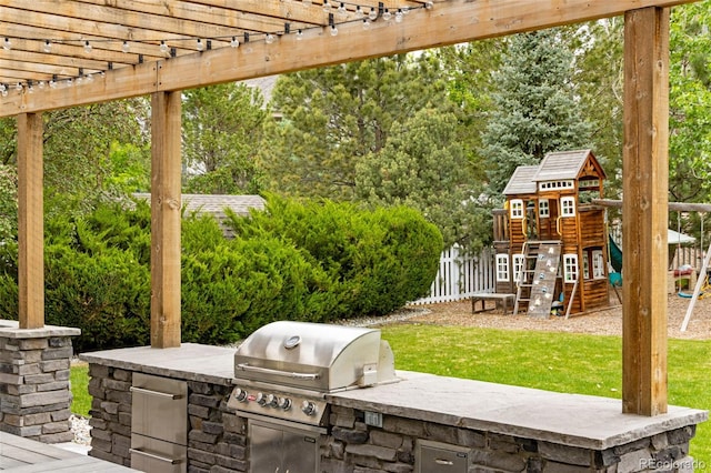 1311 Fletcher Dr, Erie, CO 80516 - view of patio / terrace featuring a playground and a pergola
