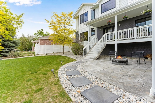 1311 Fletcher Dr, Erie, CO 80516 - view of yard with a fire pit, a porch, and a patio area