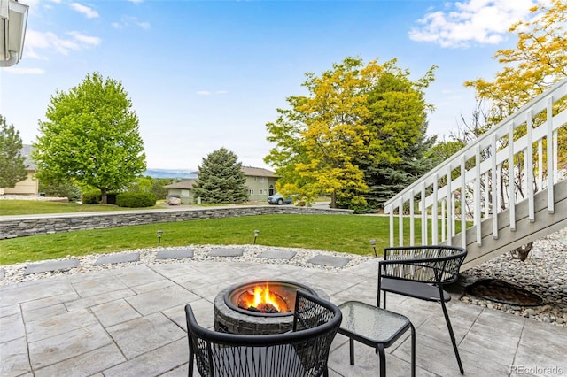 1311 Fletcher Dr, Erie, CO 80516 - view of patio / terrace with a fire pit