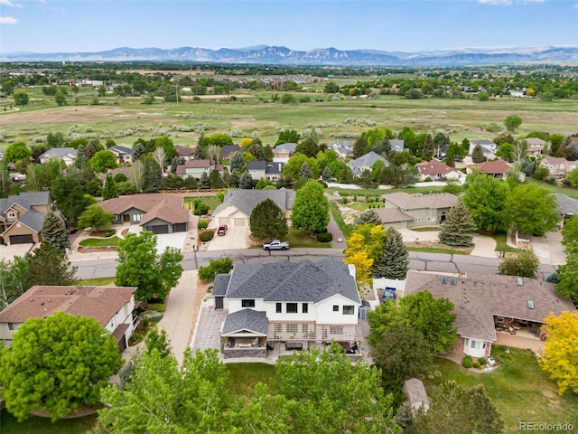 1311 Fletcher Dr, Erie, CO 80516 - aerial view of residential area featuring a mountainous background