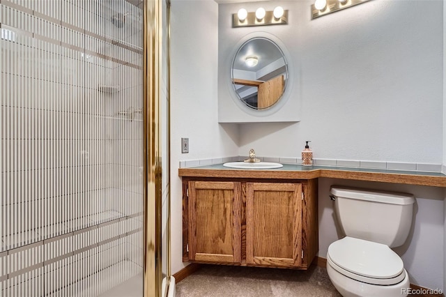 full bathroom with a stall shower, toilet, and vanity