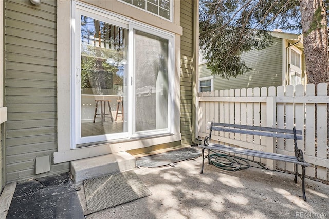 view of patio / terrace featuring fence