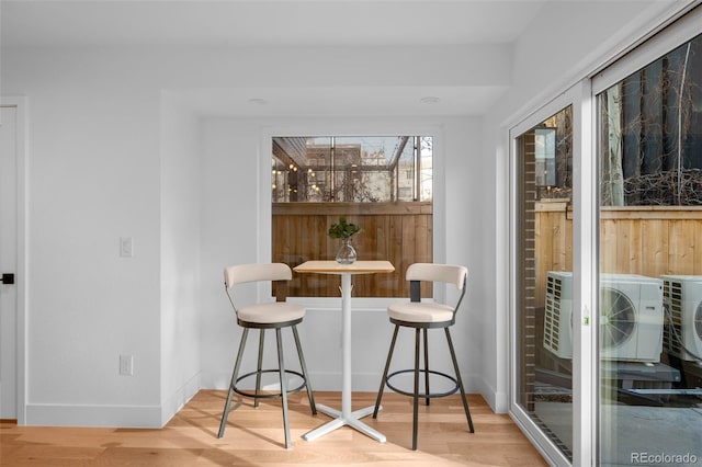 dining room with wood finished floors and baseboards