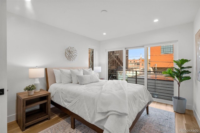 bedroom featuring recessed lighting, baseboards, light wood-type flooring, and access to outside