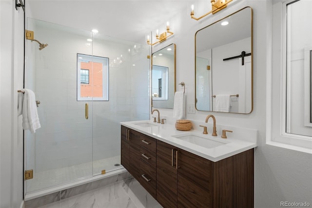 bathroom with a stall shower, double vanity, and marble look tiles