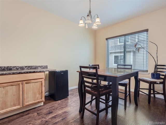 dining room with a notable chandelier and dark wood-type flooring