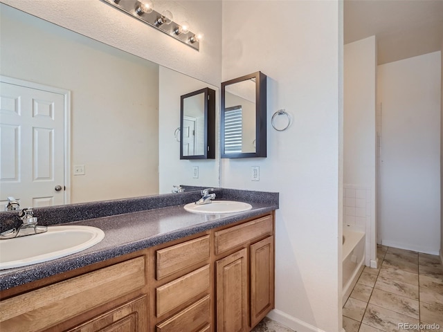 bathroom with tile flooring and dual bowl vanity