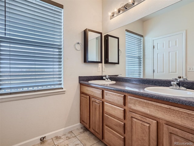 bathroom featuring tile floors and double vanity