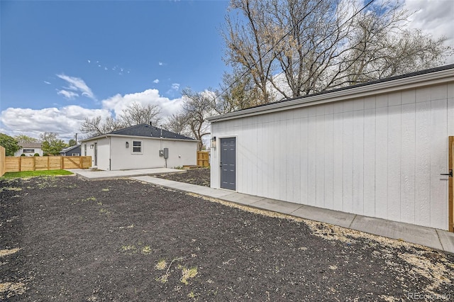 view of home's exterior with fence