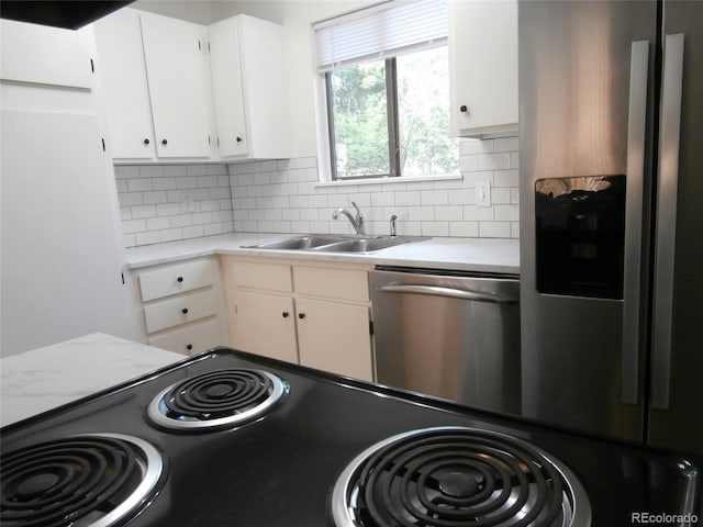 2215 S Buckley Rd Unit 201, Aurora, CO 80013 - kitchen with stainless steel appliances, a sink, light countertops, and backsplash