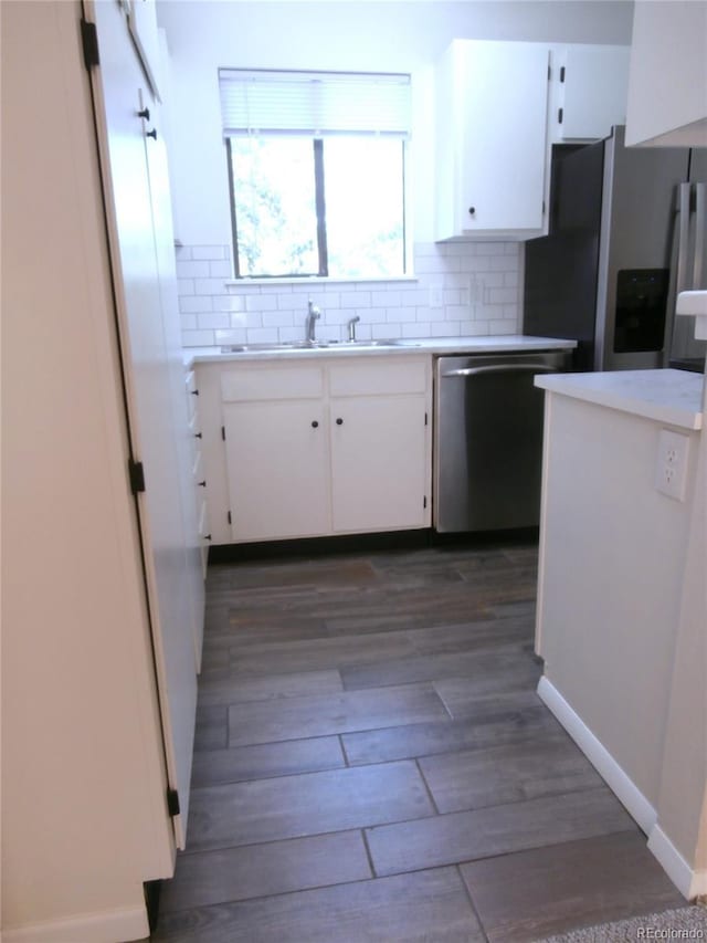2215 S Buckley Rd Unit 201, Aurora, CO 80013 - kitchen with appliances with stainless steel finishes, a sink, white cabinetry, and light countertops