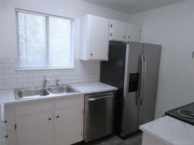 2215 S Buckley Rd Unit 201, Aurora, CO 80013 - kitchen featuring appliances with stainless steel finishes, a sink, decorative backsplash, and light countertops